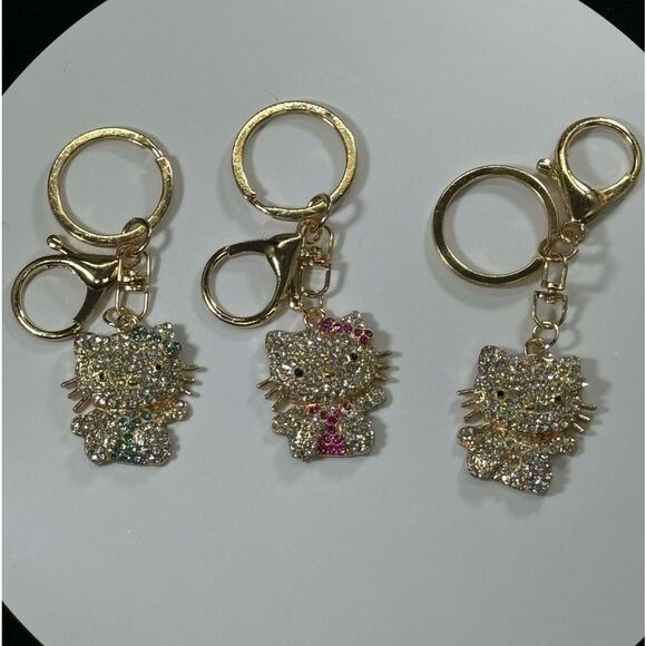 BAG CHARM Hello Kitty Gold Tone Blue Crystal Hair Bow Bag Charm Keychain - Picture 5 of 7